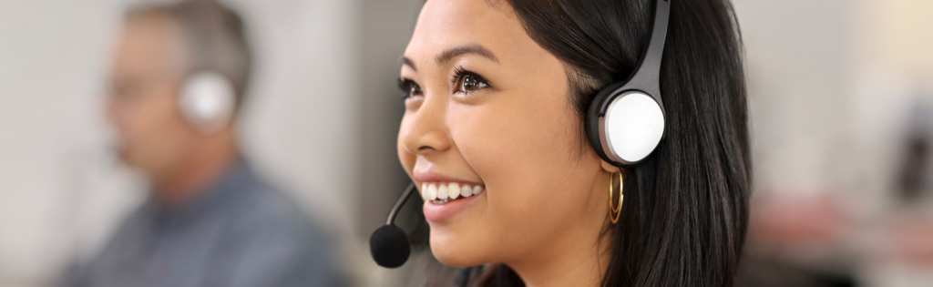 Smiling woman talking on a headset